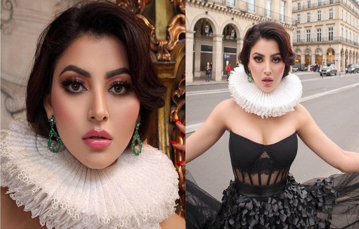 Urvashi Rautela Glares in a Black Gown and Eye-Catching Neck Ruffle on the Streets of Paris