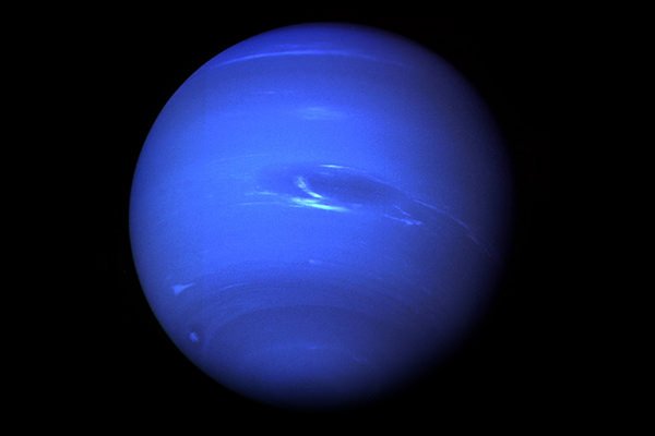 A large dark spot has been discovered on Neptune, along with a bright companion. The spot is believed to be a vortex storm.
