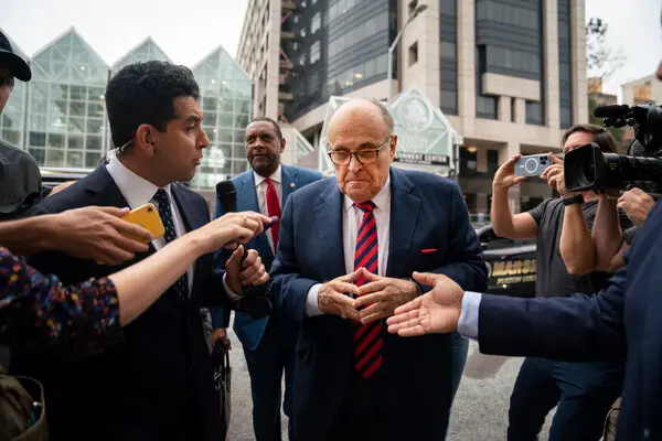 Rudy Giuliani turns himself in on charges related to efforts to overturn the then President Donald Trump's election loss in Georgia.
