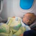 Federal officials caution against holding infants on laps during flights due to safety concerns after Alaska incident.