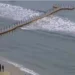 13 people, including two children, were injured on Saturday at Varkala Beach, India, when a large wave overturned the floating bridge they were on. No critical injuries were reported, but a 14-year-old girl remains under observation.
