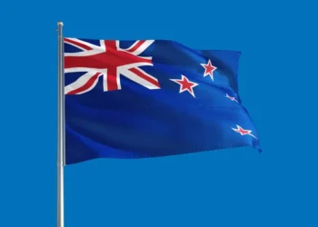 New Zealand’s economy unexpectedly contracted in the final three months of last year, confirming a recession and sending the currency initially lower as traders boosted bets on interest-rate cuts.